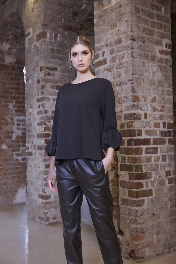 KATE COOPER Black Top With Ruffled Sleeve Cuffs KCW24155